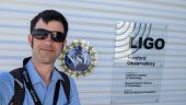 Chris in fromt of the LIGO Hanford sign